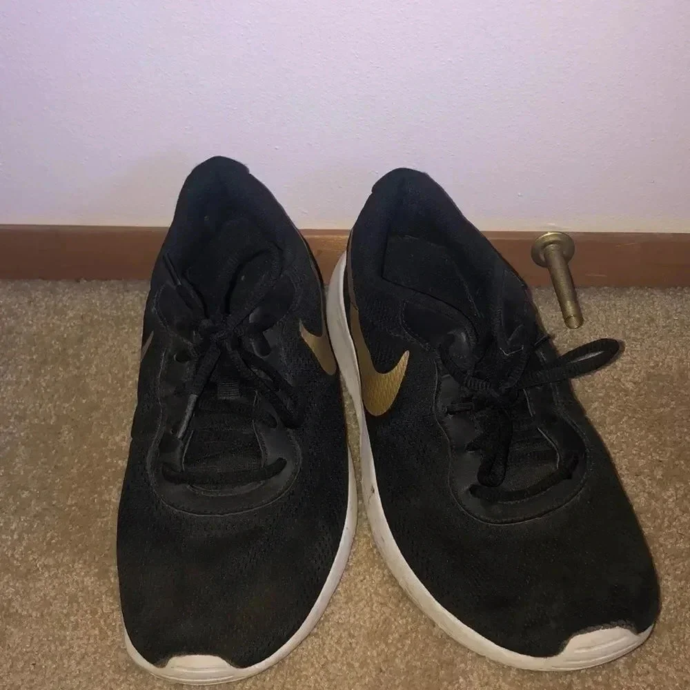 Nike’s with a gold swoosh
